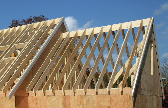 A house being built with wooden framing